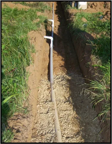 Image of a low pressure pipe manifold trench and connections to LPP valves and distribution lines.
