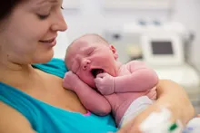 Woman holding a newborn baby